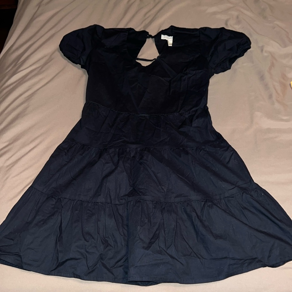 Cute black dress. Wore once for an event, has cinched sleeves
